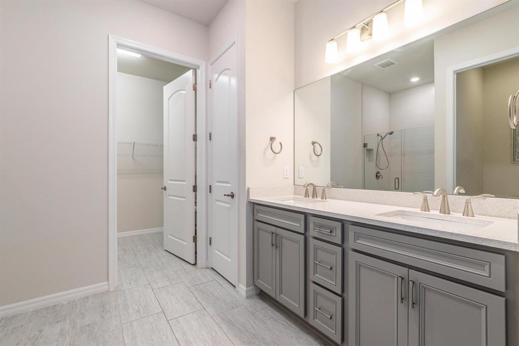 9208 Passiflora Way, Unit 102 Boca Raton, FL 33428 - Photo 19 of 30 a spacious bathroom with a granite countertop sink mirror and double