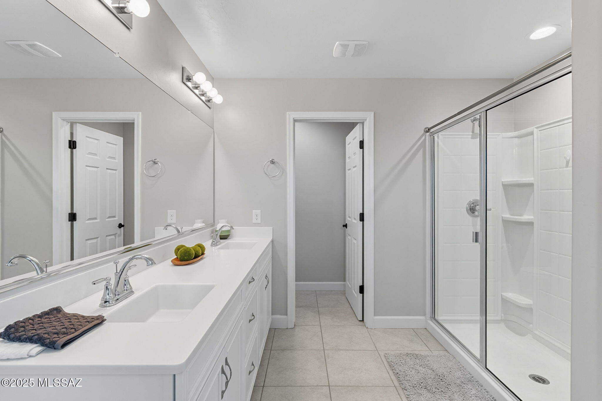 12100 East Ryscott Circle Vail, AZ 85641 - Photo 29 of 53 a bathroom with a sink double vanity and shower