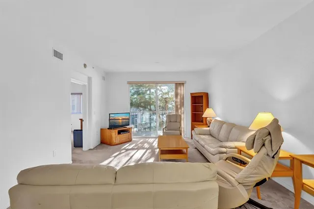 a bathroom with a double vanity sink a toilet and a mirror