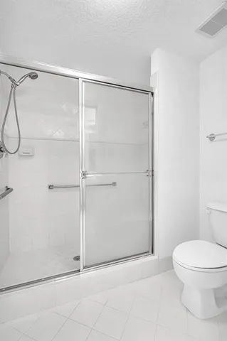 a view of a balcony with wooden floor