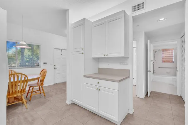 a view of a dining room with furniture and window