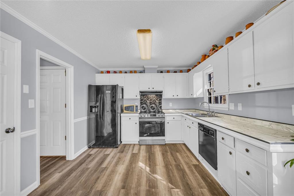 375 Brookstone Drive Athens, GA 30605 - Photo 14 of 70 a kitchen with stainless steel appliances granite countertop a refrigerator and a stove top oven