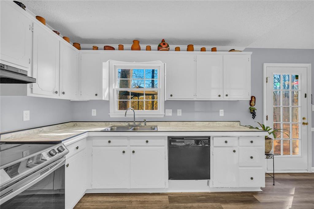 375 Brookstone Drive Athens, GA 30605 - Photo 17 of 70 a kitchen with stainless steel appliances granite countertop a stove a sink and a refrigerator
