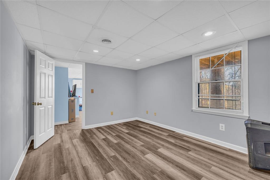 375 Brookstone Drive Athens, GA 30605 - Photo 23 of 70 a view of empty room with wooden floor and fan