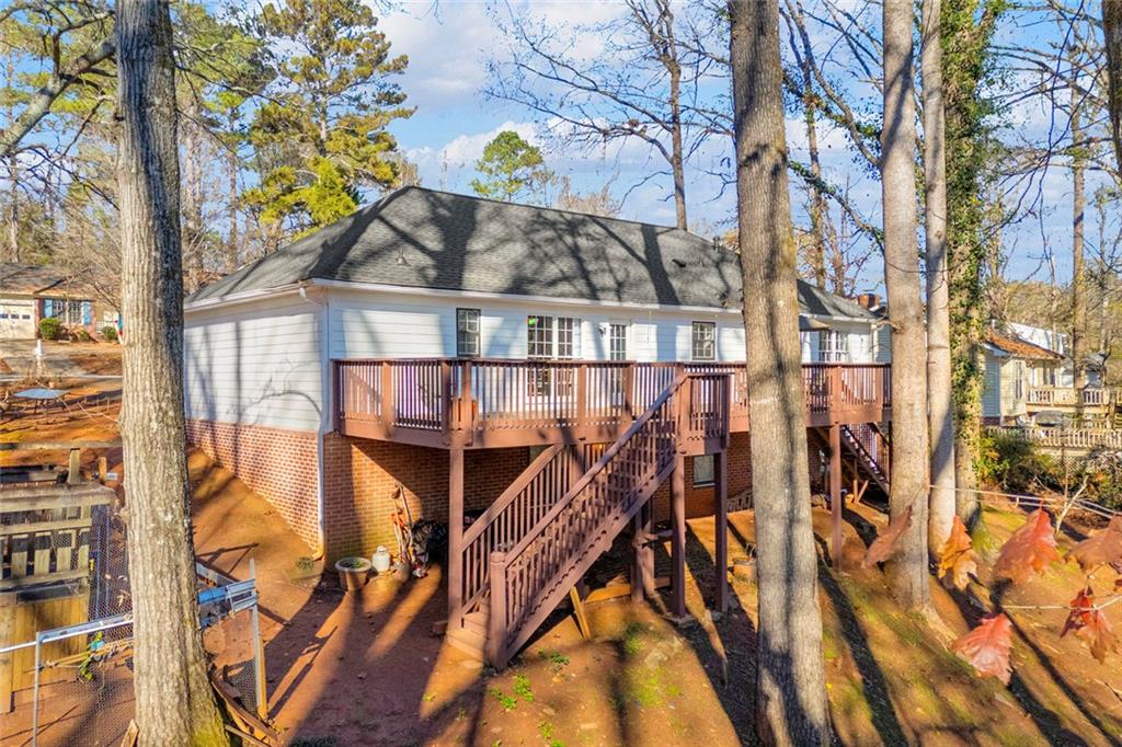 375 Brookstone Drive Athens, GA 30605 - Photo 49 of 70 a view of a house with a small yard and wooden fence