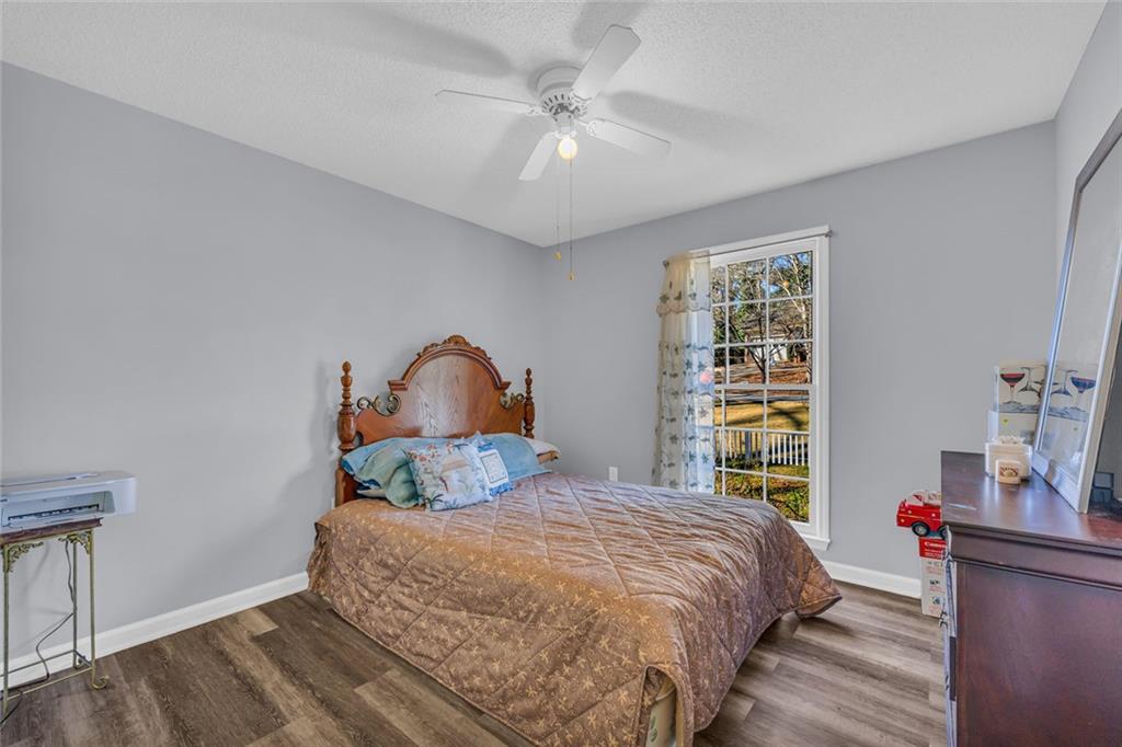 375 Brookstone Drive Athens, GA 30605 - Photo 57 of 70 a bedroom with a bed and a dresser next to a window