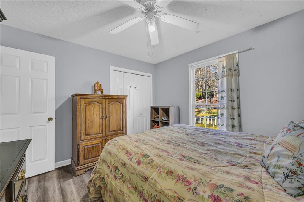 375 Brookstone Drive Athens, GA 30605 - Photo 60 of 70 a bedroom with a bed and a chandelier