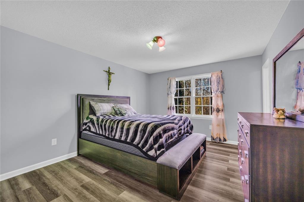 375 Brookstone Drive Athens, GA 30605 - Photo 61 of 70 a bed sitting in a bedroom next to a window