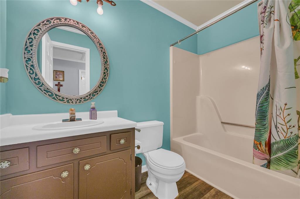 375 Brookstone Drive Athens, GA 30605 - Photo 65 of 70 a bathroom with a toilet sink vanity tub and mirror