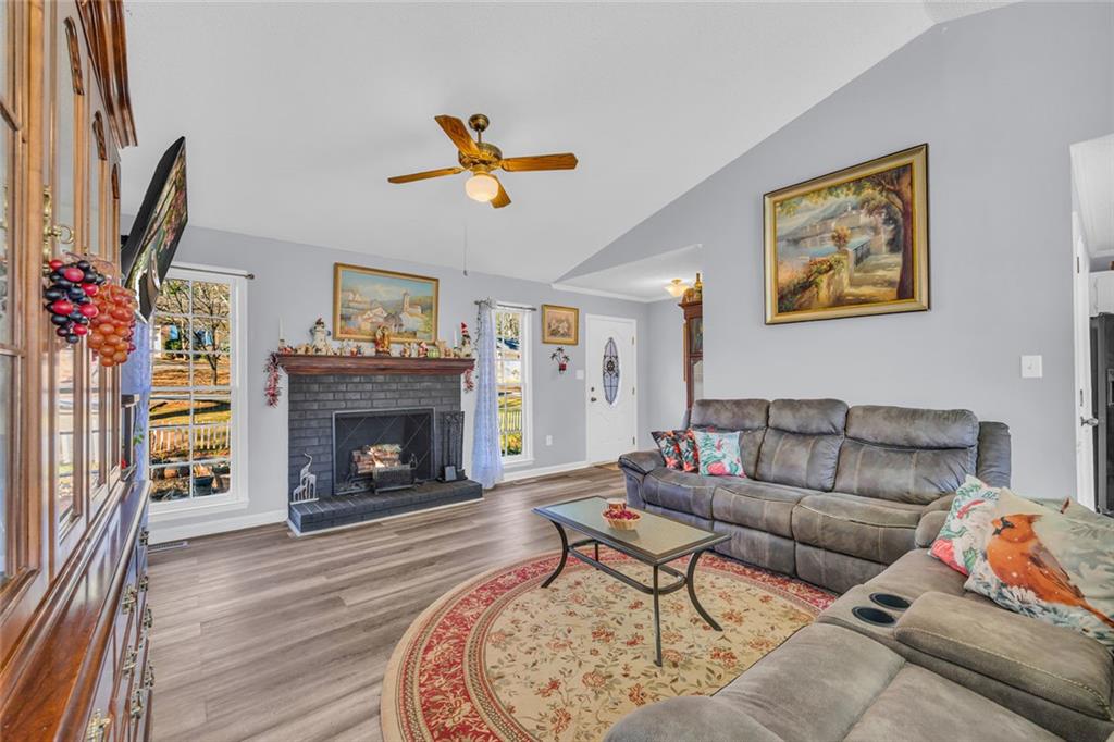 375 Brookstone Drive Athens, GA 30605 - Photo 7 of 70 a living room with furniture and a fireplace