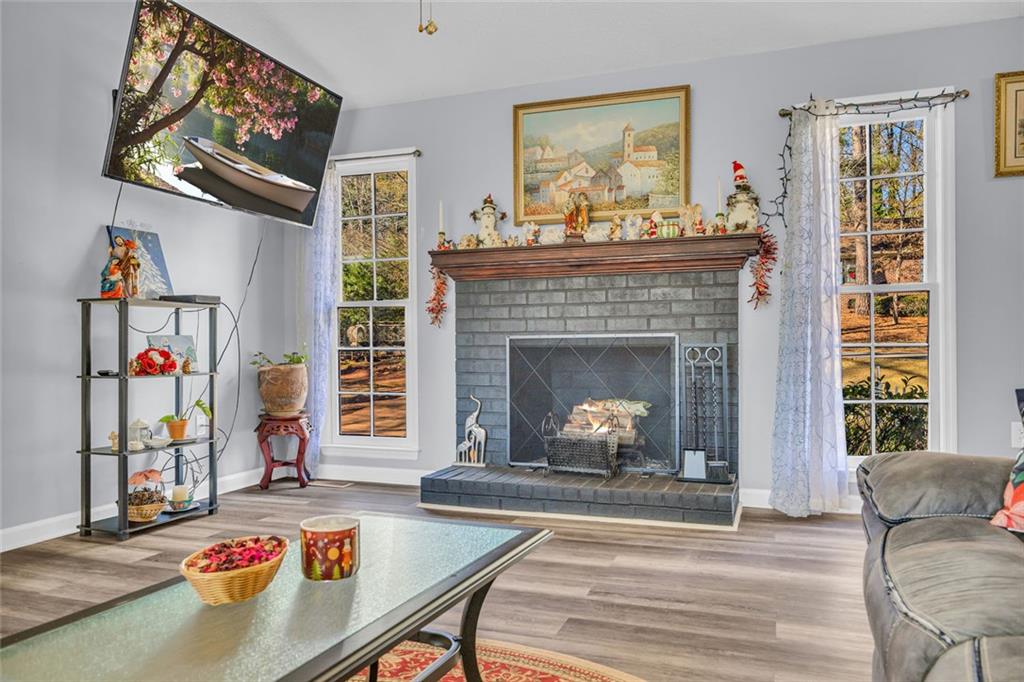 375 Brookstone Drive Athens, GA 30605 - Photo 8 of 70 a living room with furniture and a fireplace