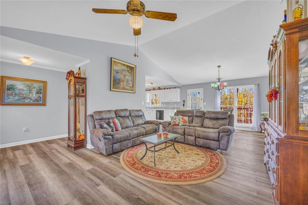 375 Brookstone Drive Athens, GA 30605 - Photo 9 of 70 a living room with furniture and a chandelier