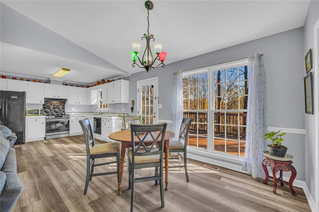 375 Brookstone Drive Athens, GA 30605 - Photo 10 of 70 a view of a dining room with furniture window and wooden floor