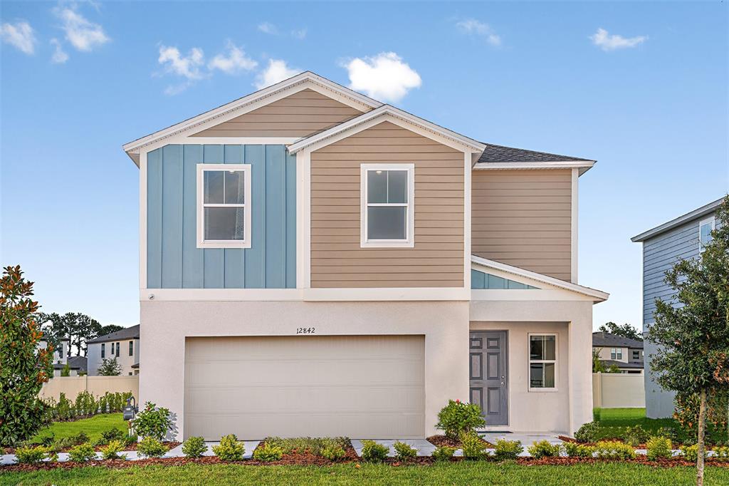 12842 Canter Call Road Lithia, FL 33547 - Photo 1 of 1 a front view of a house with garden