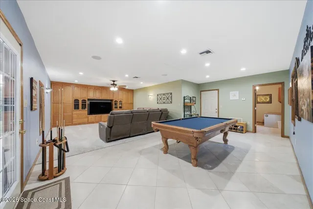 a view of a hallway with paintings on the wall