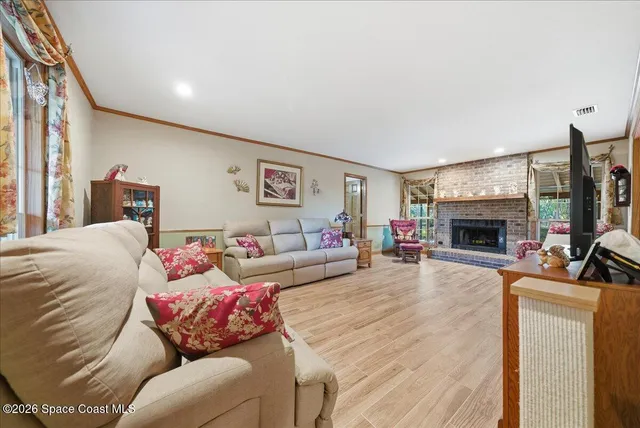 a view of kitchen with granite countertop dining table chairs sink and granite counter tops