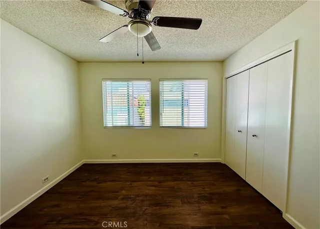 a view of room with window and ceiling fan