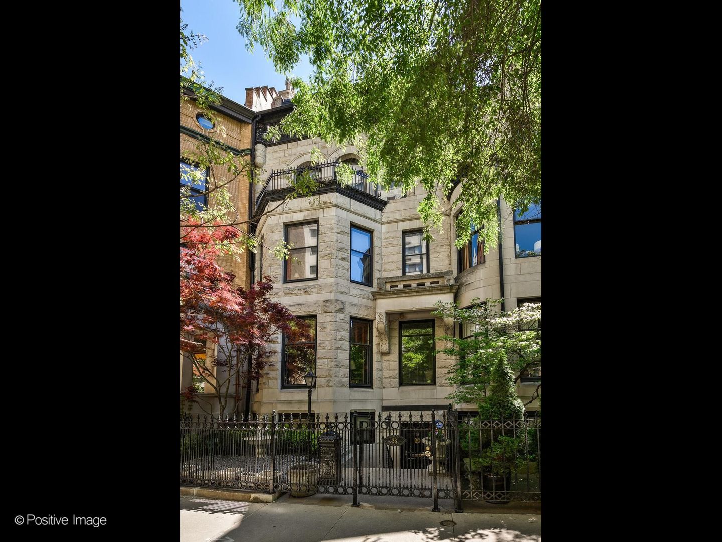 33 East Division Street Chicago, IL 60611 - Photo 2 of 34 a view of a large building with a tree and windows