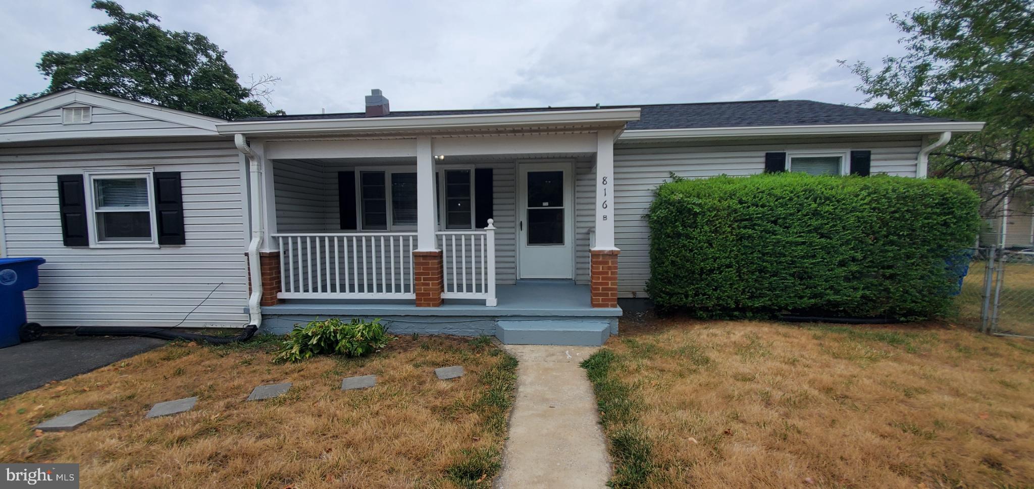 816 North Commerce Avenue, Unit B Front Royal, VA 22630 - Photo 1 of 12 front view of a house with a yard