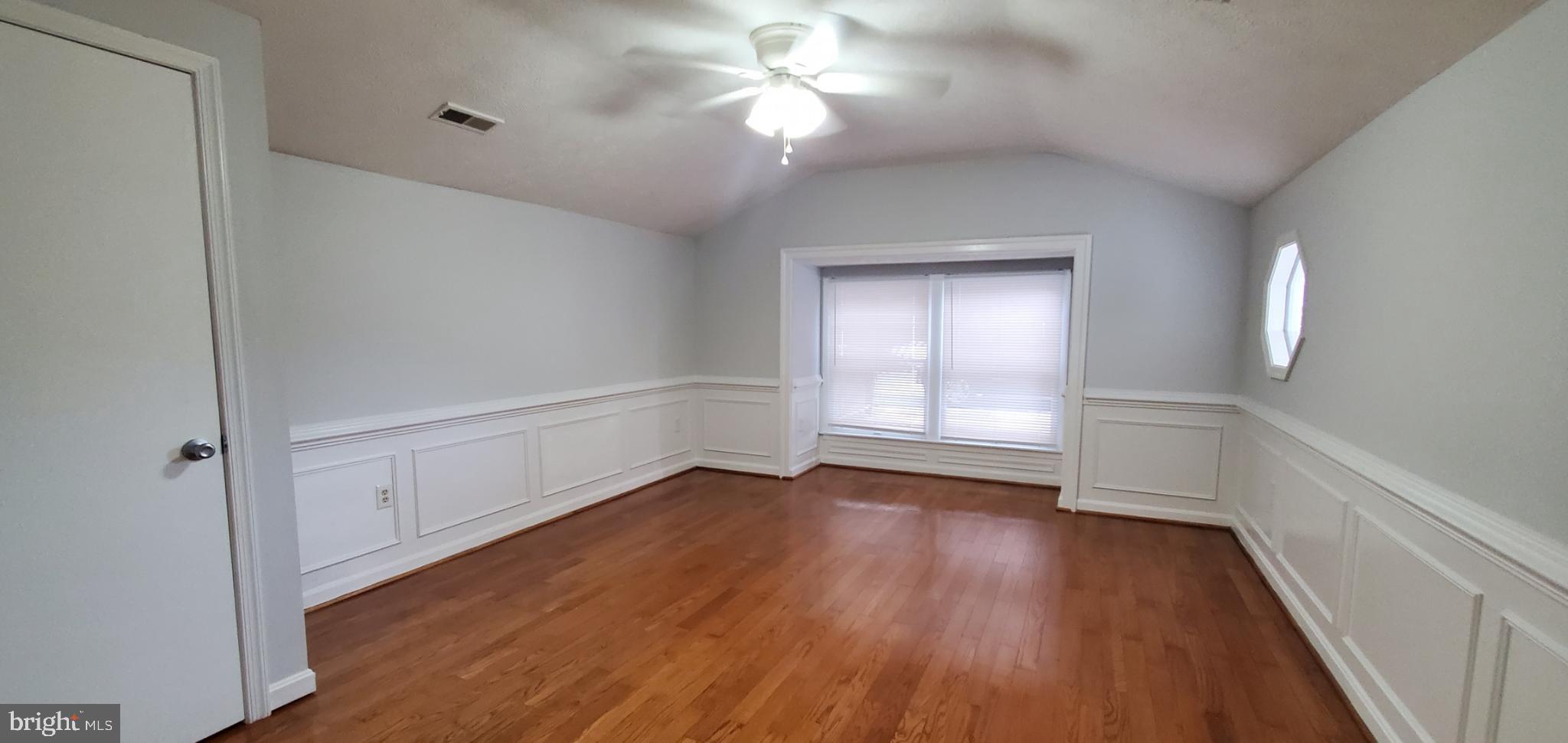 816 North Commerce Avenue, Unit B Front Royal, VA 22630 - Photo 6 of 12 wooden floor in an empty room with a window