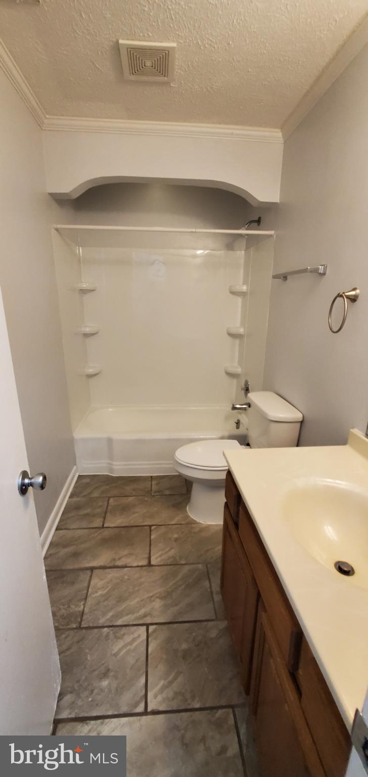 816 North Commerce Avenue, Unit B Front Royal, VA 22630 - Photo 7 of 12 a bathroom with a sink and a mirror