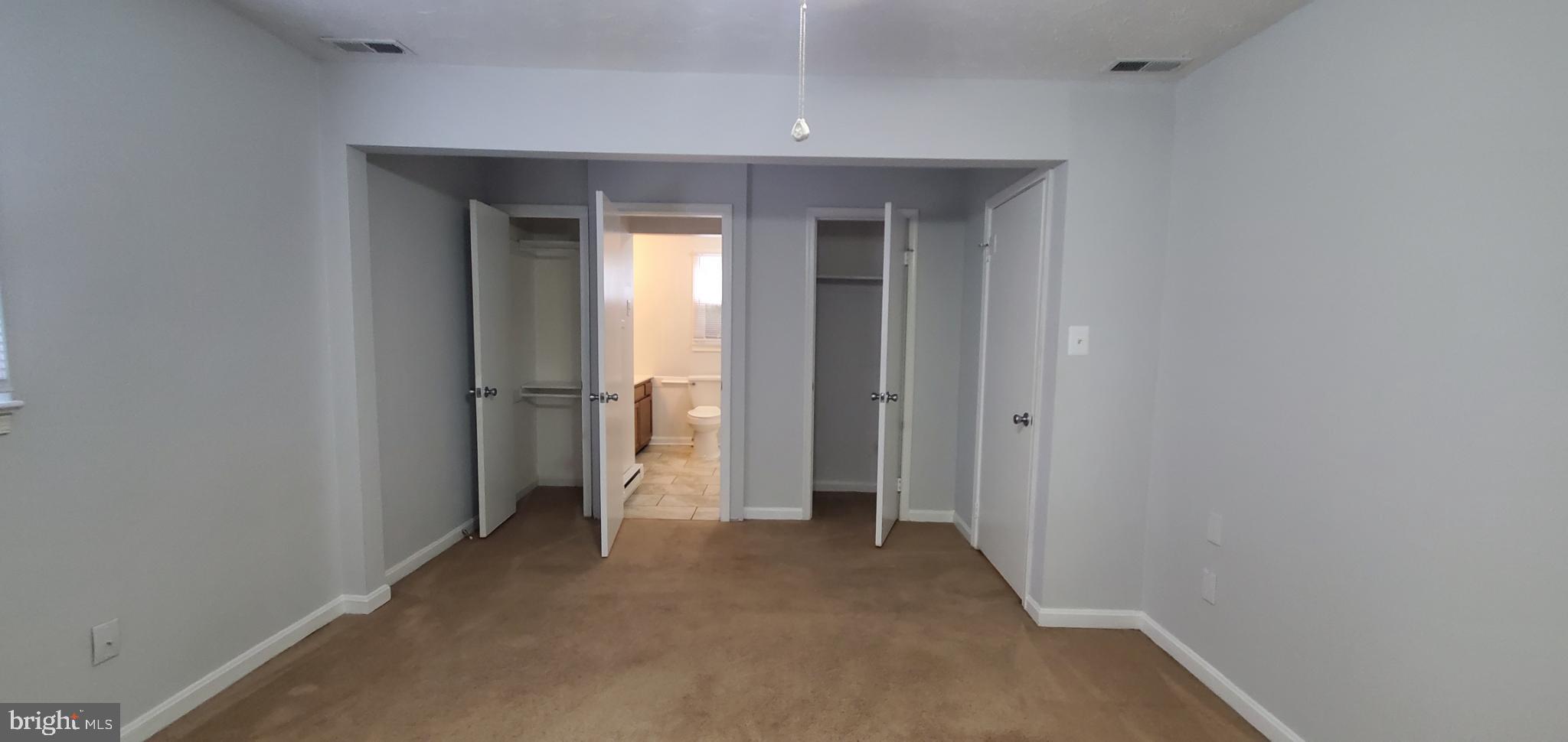 816 North Commerce Avenue, Unit B Front Royal, VA 22630 - Photo 9 of 12 a view of a hallway with wooden shelves