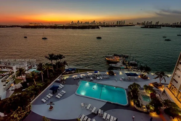 an ocean view with a table and chairs