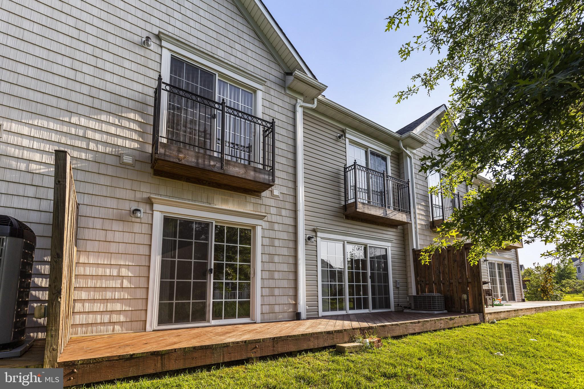 674 Ruxton Road, Unit 63 Solomons, MD 20629 - Photo 2 of 32 Rear of home with twin balconies, twin sliders.
