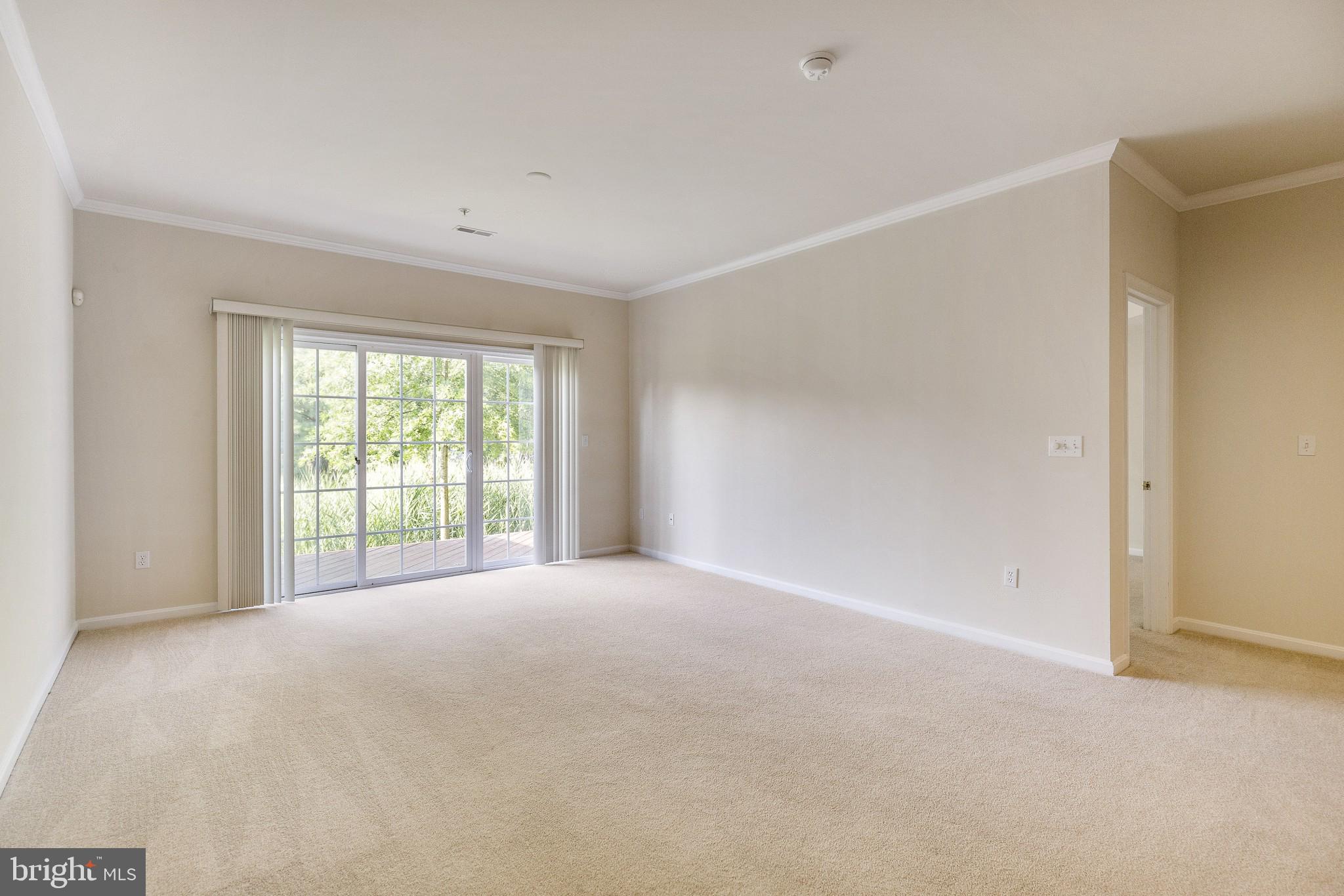 674 Ruxton Road, Unit 63 Solomons, MD 20629 - Photo 13 of 32 Family room with doors to deck.