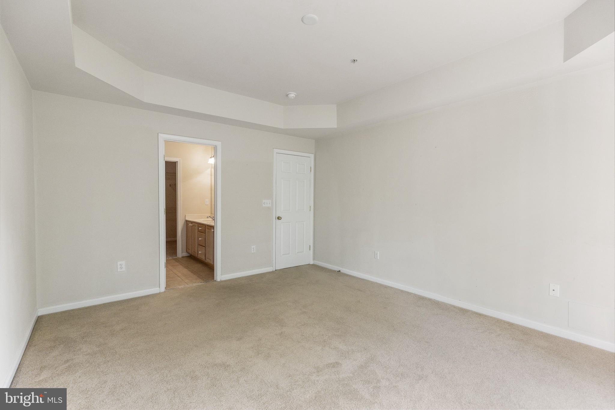 674 Ruxton Road, Unit 63 Solomons, MD 20629 - Photo 14 of 32 Owner's suite with private bath, tray ceilings.