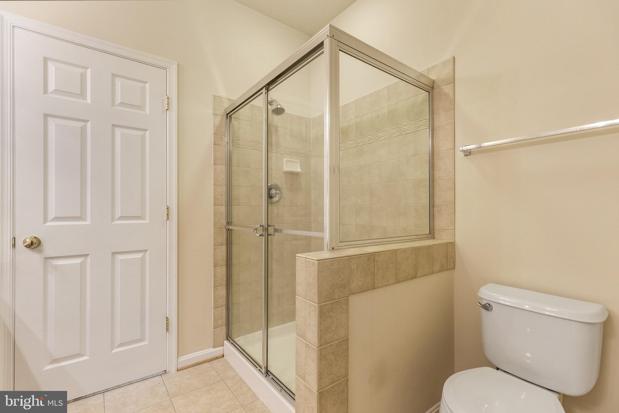 674 Ruxton Road, Unit 63 Solomons, MD 20629 - Photo 17 of 32 Owner's bath with tiled shower.