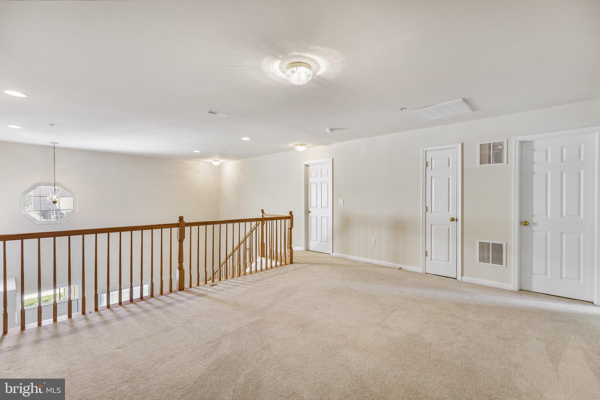 674 Ruxton Road, Unit 63 Solomons, MD 20629 - Photo 20 of 32 Loft looking toward stair, storage, utility room.