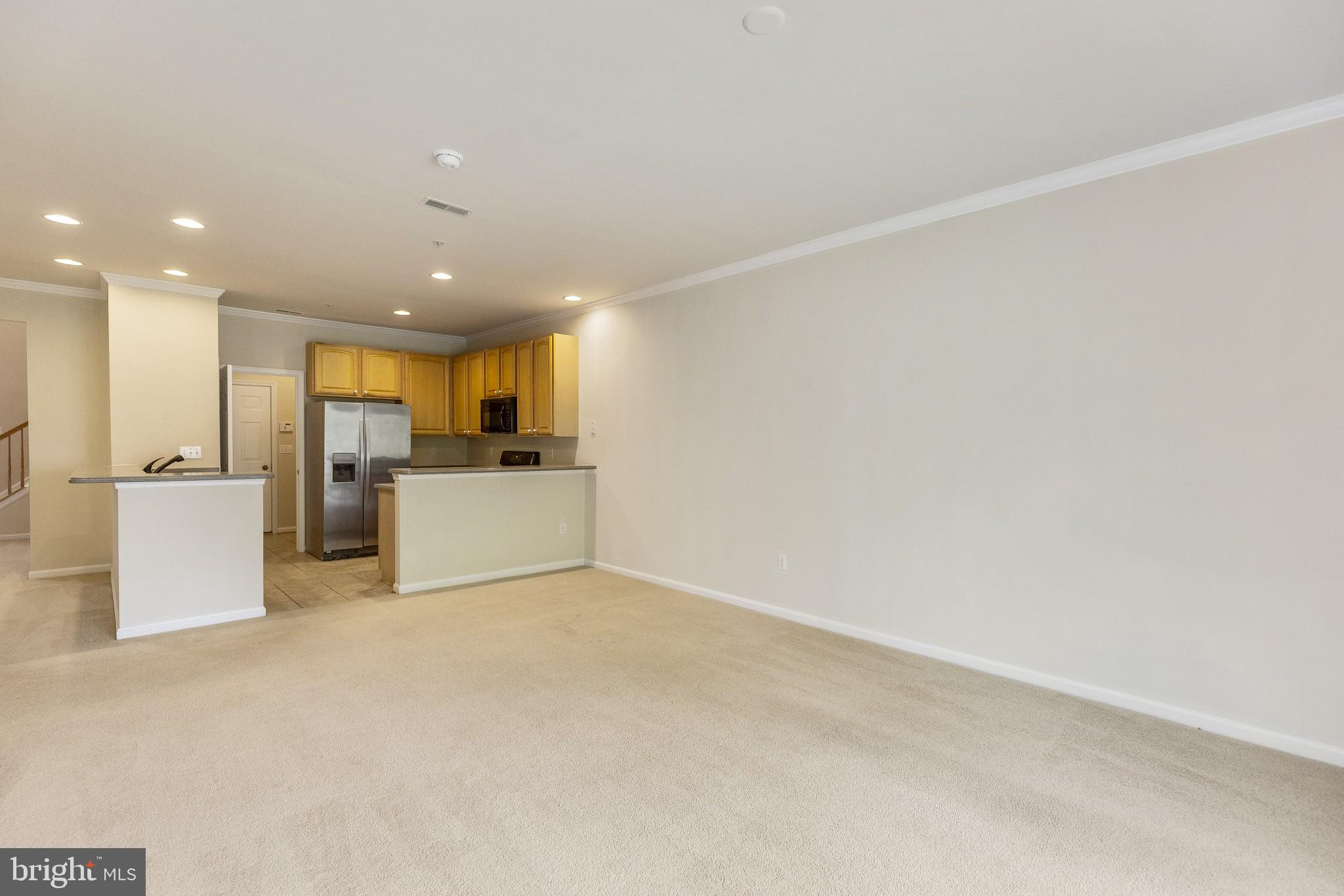 674 Ruxton Road, Unit 63 Solomons, MD 20629 - Photo 10 of 32 Family room through to kitchen.