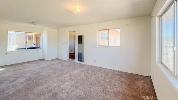 a view of a kitchen with a sink and cabinets