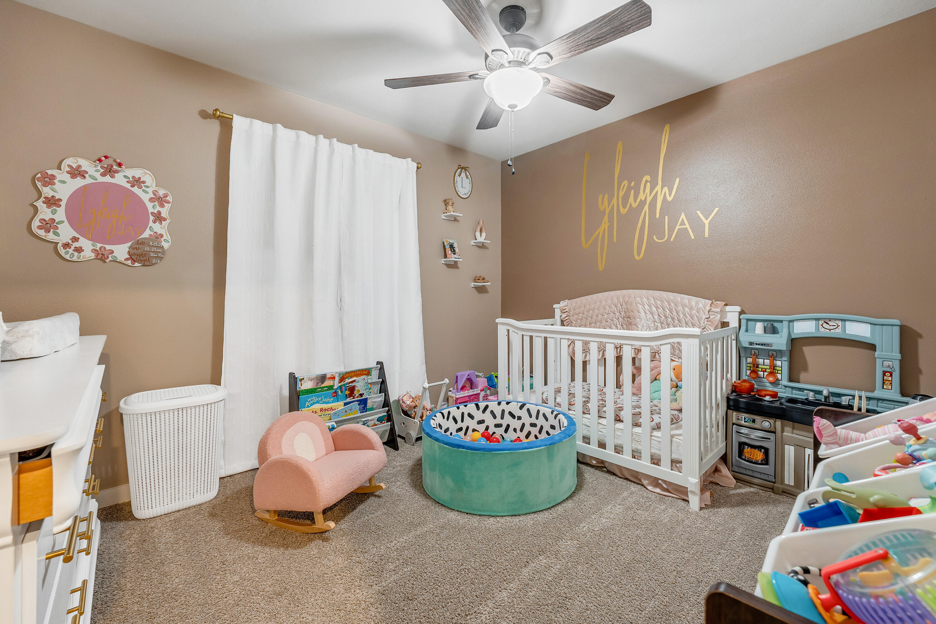 7510 28th Street Lubbock, TX 79407 - Photo 12 of 19 a bedroom with a bed and a chandelier