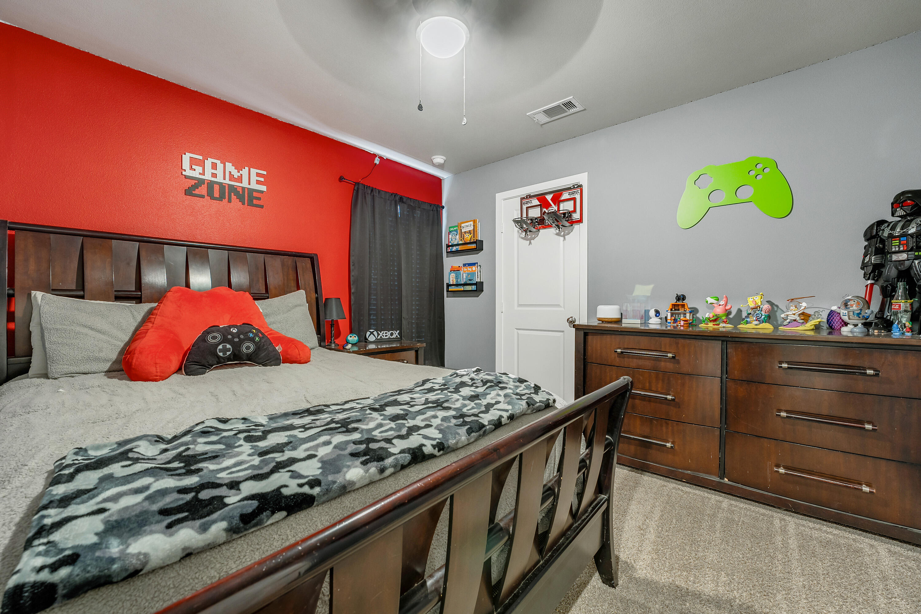 7510 28th Street Lubbock, TX 79407 - Photo 14 of 19 a bed room with a bed and a couch