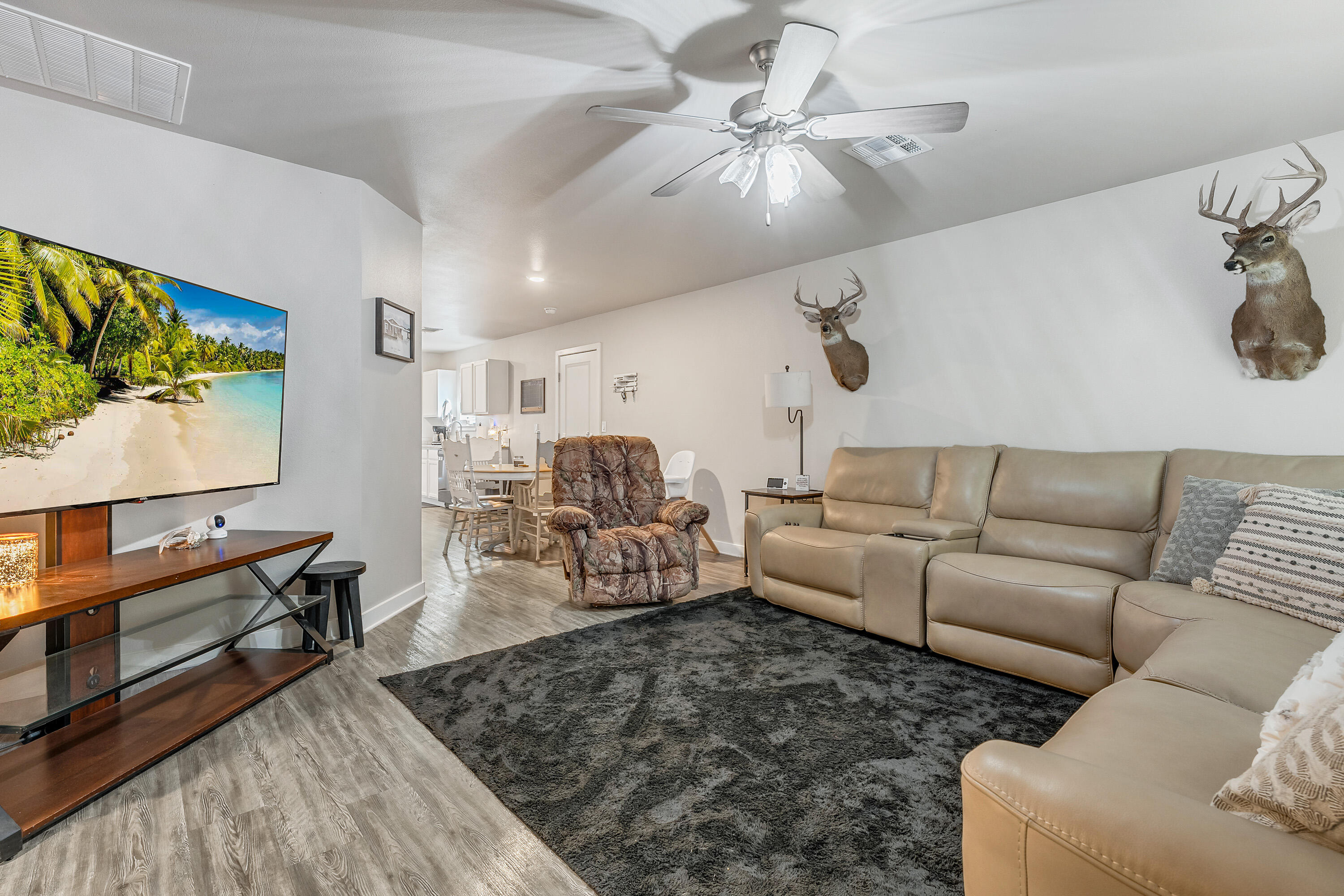 7510 28th Street Lubbock, TX 79407 - Photo 3 of 19 a living room with furniture and a flat screen tv
