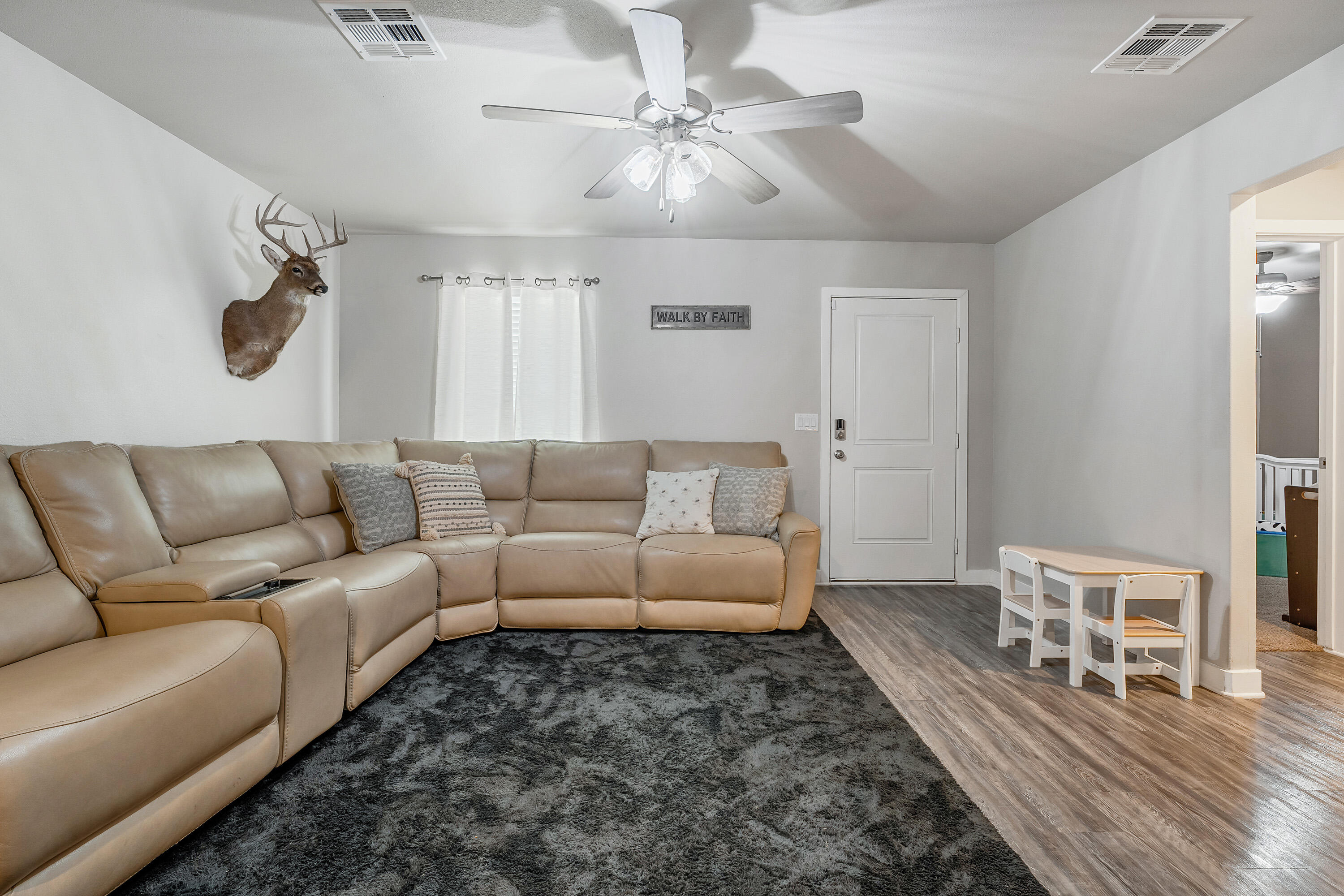 7510 28th Street Lubbock, TX 79407 - Photo 4 of 19 a living room with furniture and a wooden floor