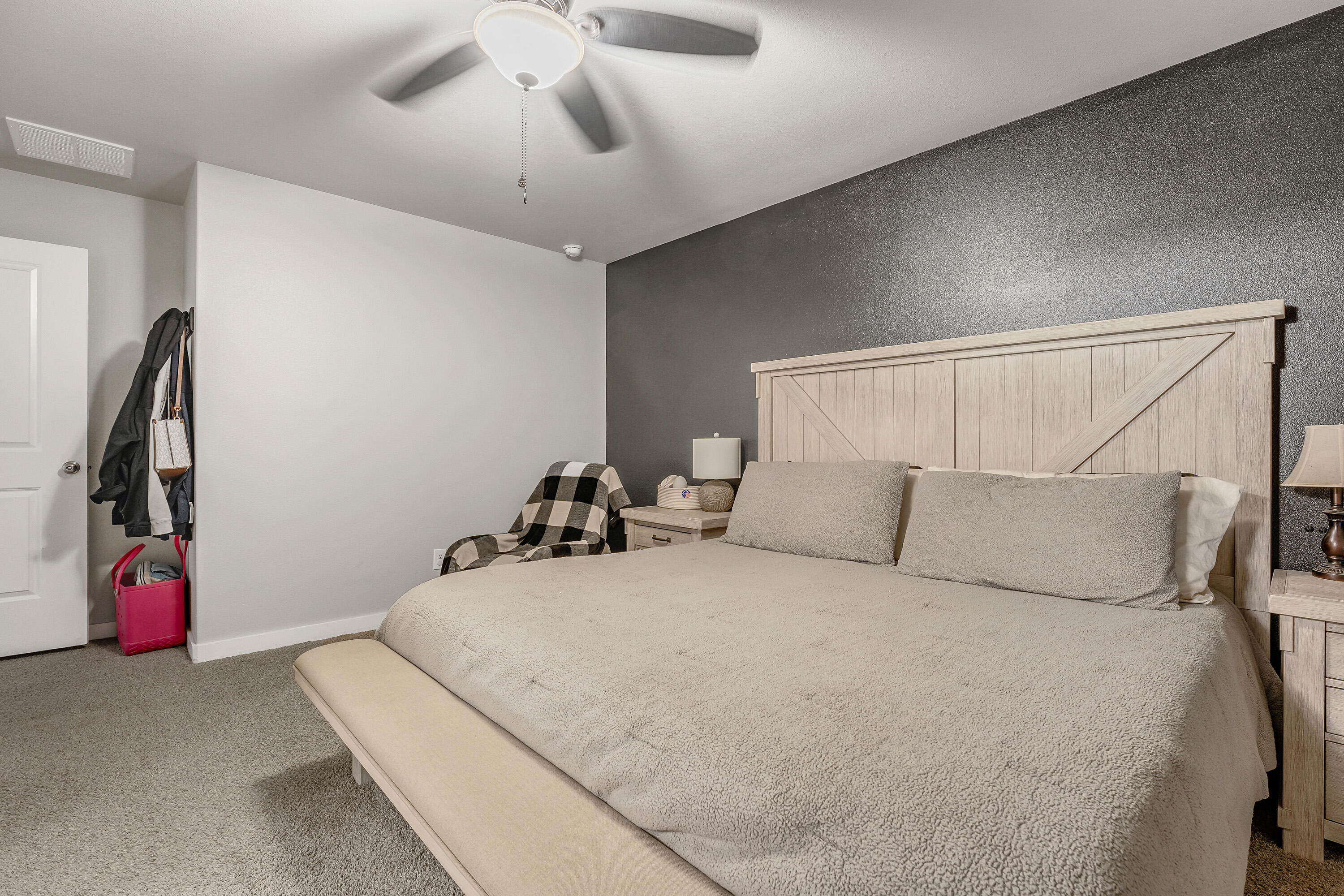 7510 28th Street Lubbock, TX 79407 - Photo 10 of 19 a bedroom with a bed and a large walk in closet
