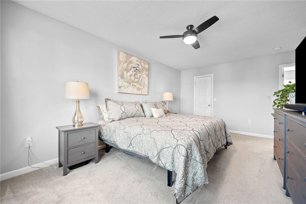 264 Lily Ridge Drive Canonsburg, PA 15317 - Photo 29 of 50 a spacious bedroom with a bed and a chandelier
