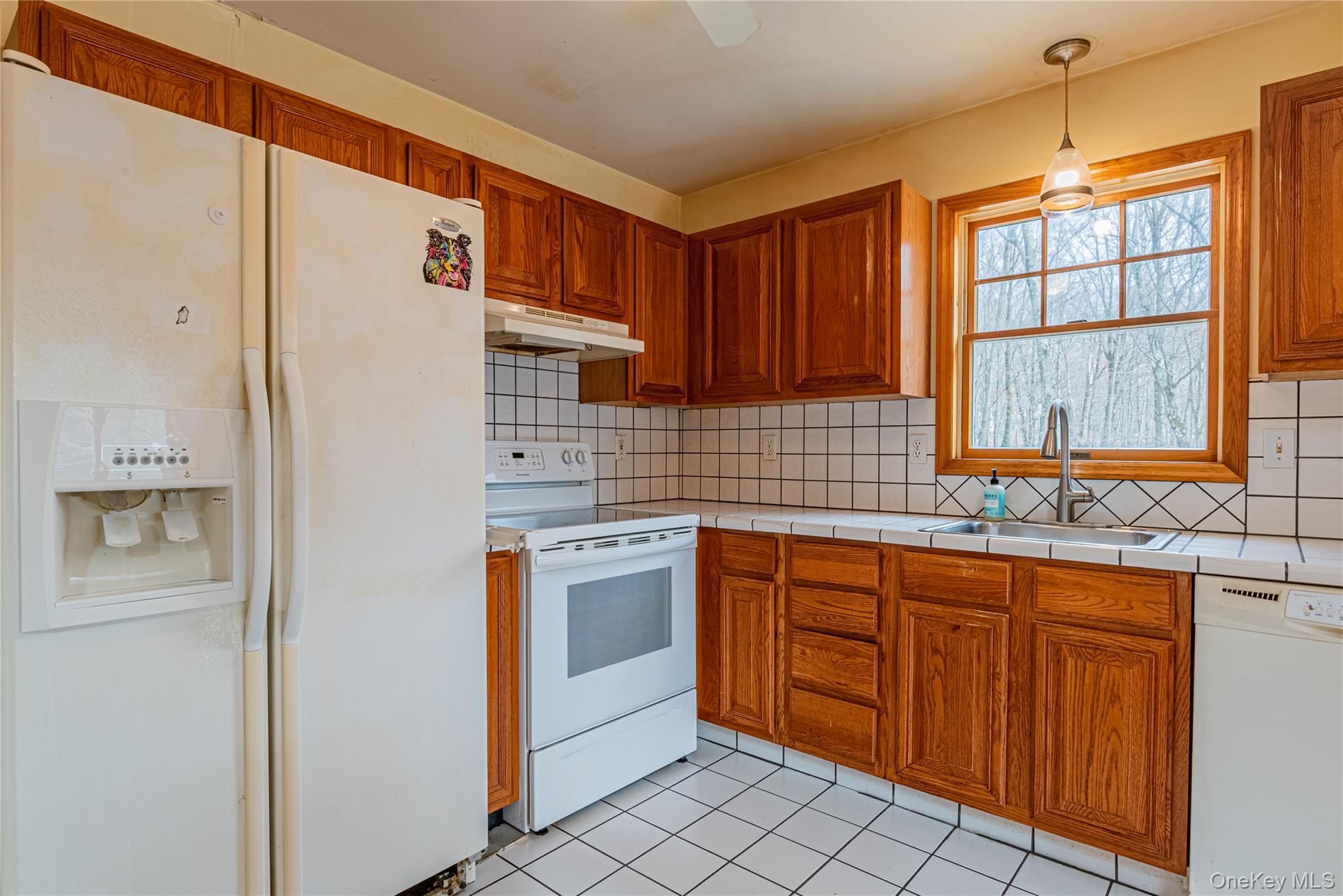 616 North Elting Corners Road Highland, NY 12528 - Photo 11 of 27 a kitchen with stainless steel appliances granite countertop a refrigerator and a sink