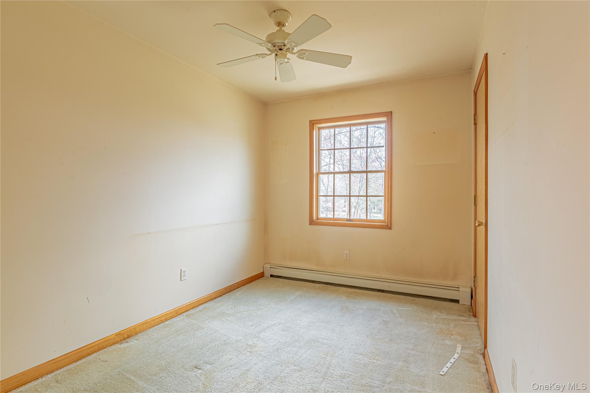 616 North Elting Corners Road Highland, NY 12528 - Photo 16 of 27 an empty room with a window and a ceiling fan