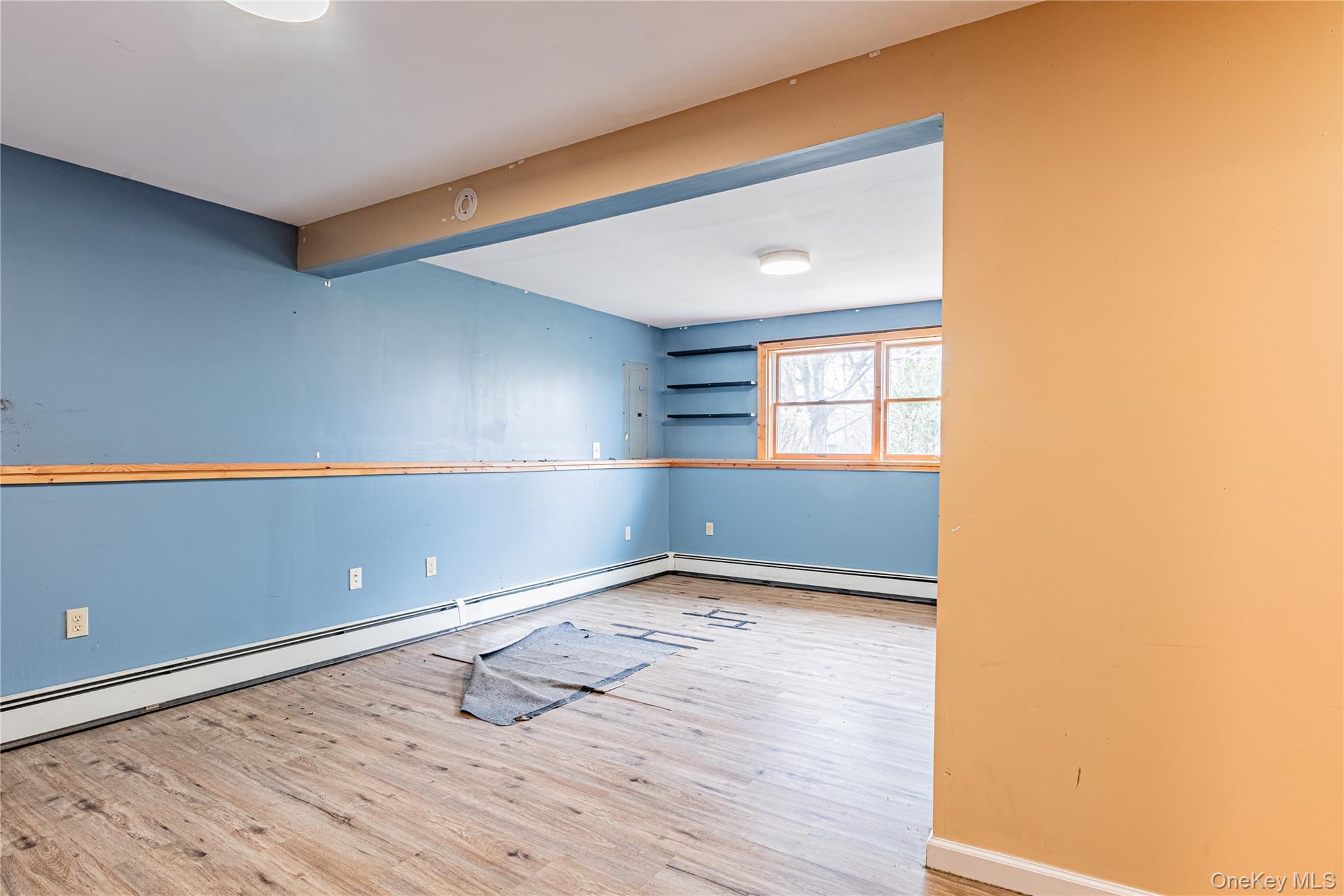 616 North Elting Corners Road Highland, NY 12528 - Photo 18 of 27 an empty room with wooden floor and windows