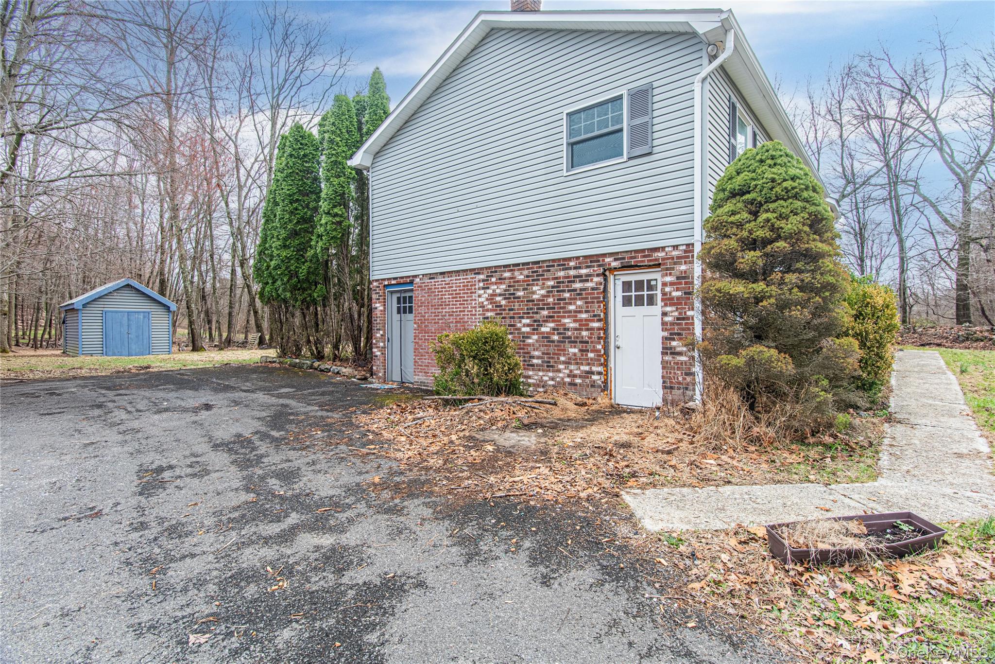 616 North Elting Corners Road Highland, NY 12528 - Photo 20 of 27 a view of a house with a yard and garage