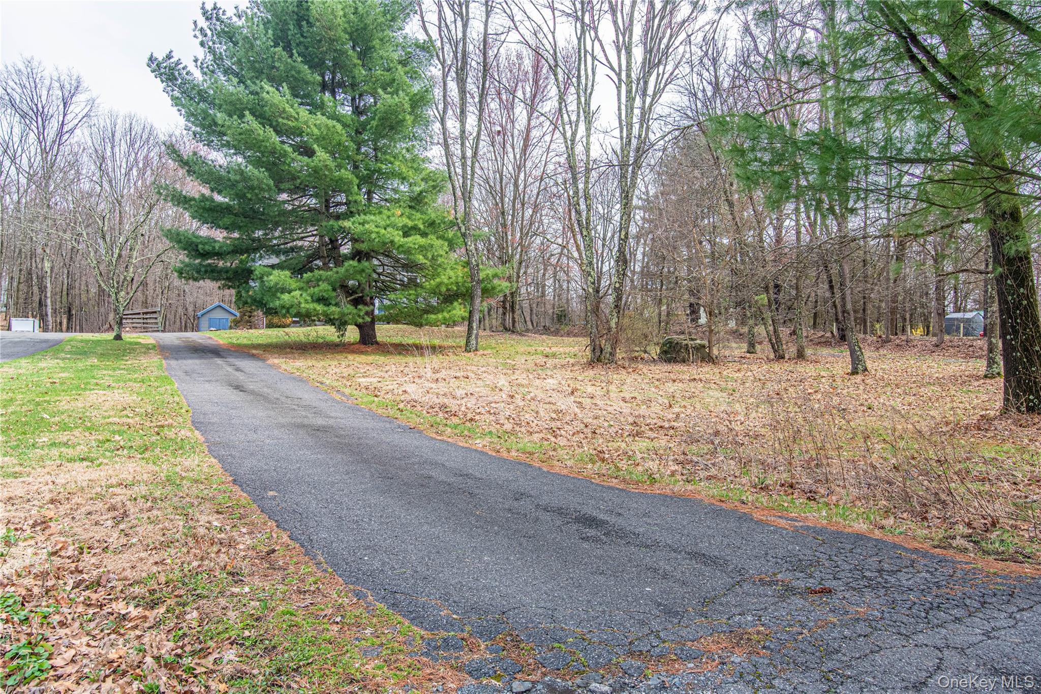 616 North Elting Corners Road Highland, NY 12528 - Photo 23 of 27 a backyard of a house with large trees