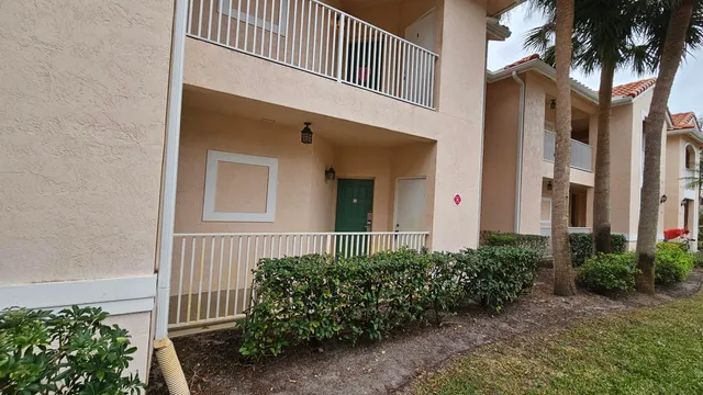a front view of a house with a plants
