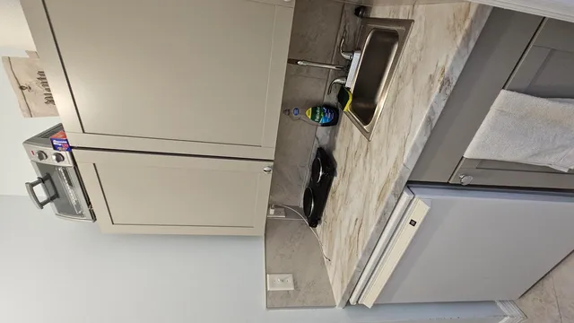 a view of a storage and utility room with stairs