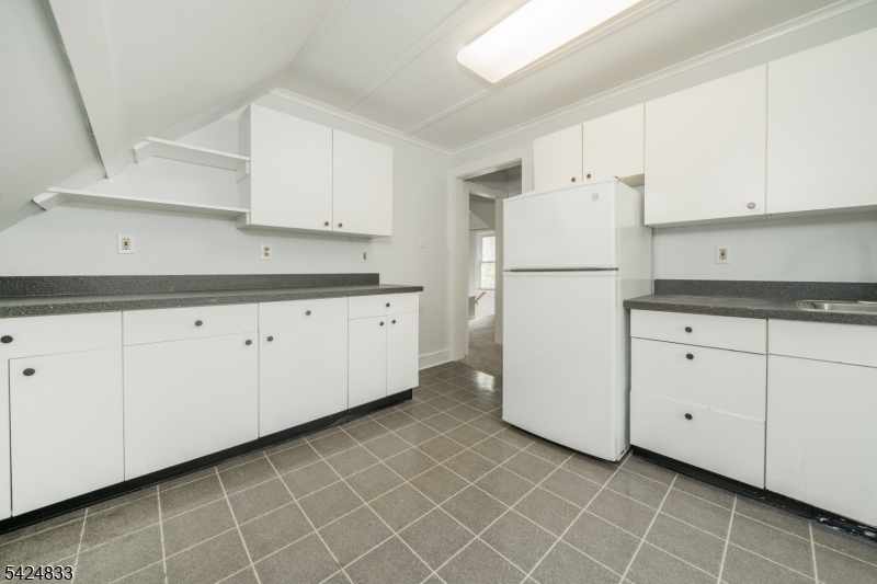 331 Main Street Chatham, NJ 07928 - Photo 7 of 15 a kitchen with white cabinets and white appliances