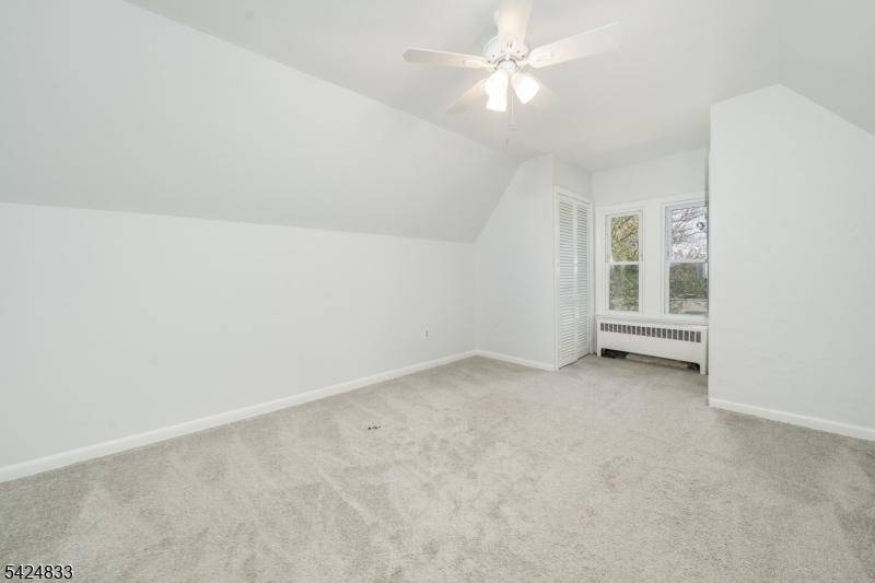 331 Main Street Chatham, NJ 07928 - Photo 10 of 15 an empty room with a ceiling fan and window