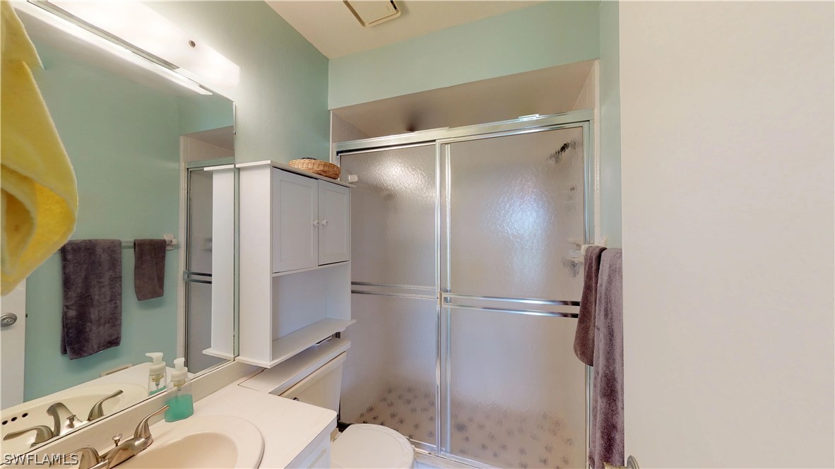 1100 Pondella Road, Unit 811 Cape Coral, FL 33909 - Photo 13 of 35 a bathroom with a sink toilet and shower